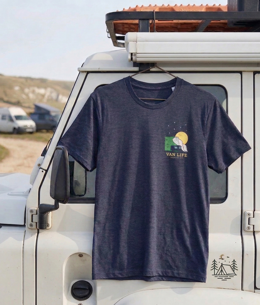 Navy blue t-shirt with 'Van Life' design hanging on a white vehicle